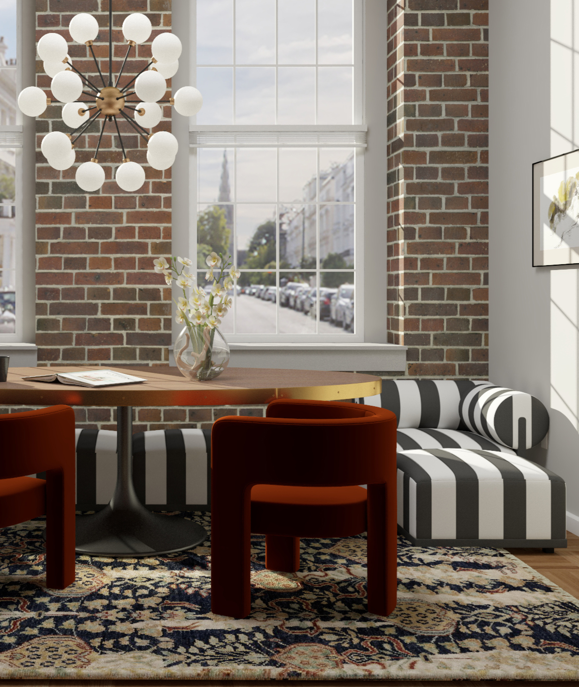 Brick loft dining area with a striped sofa.